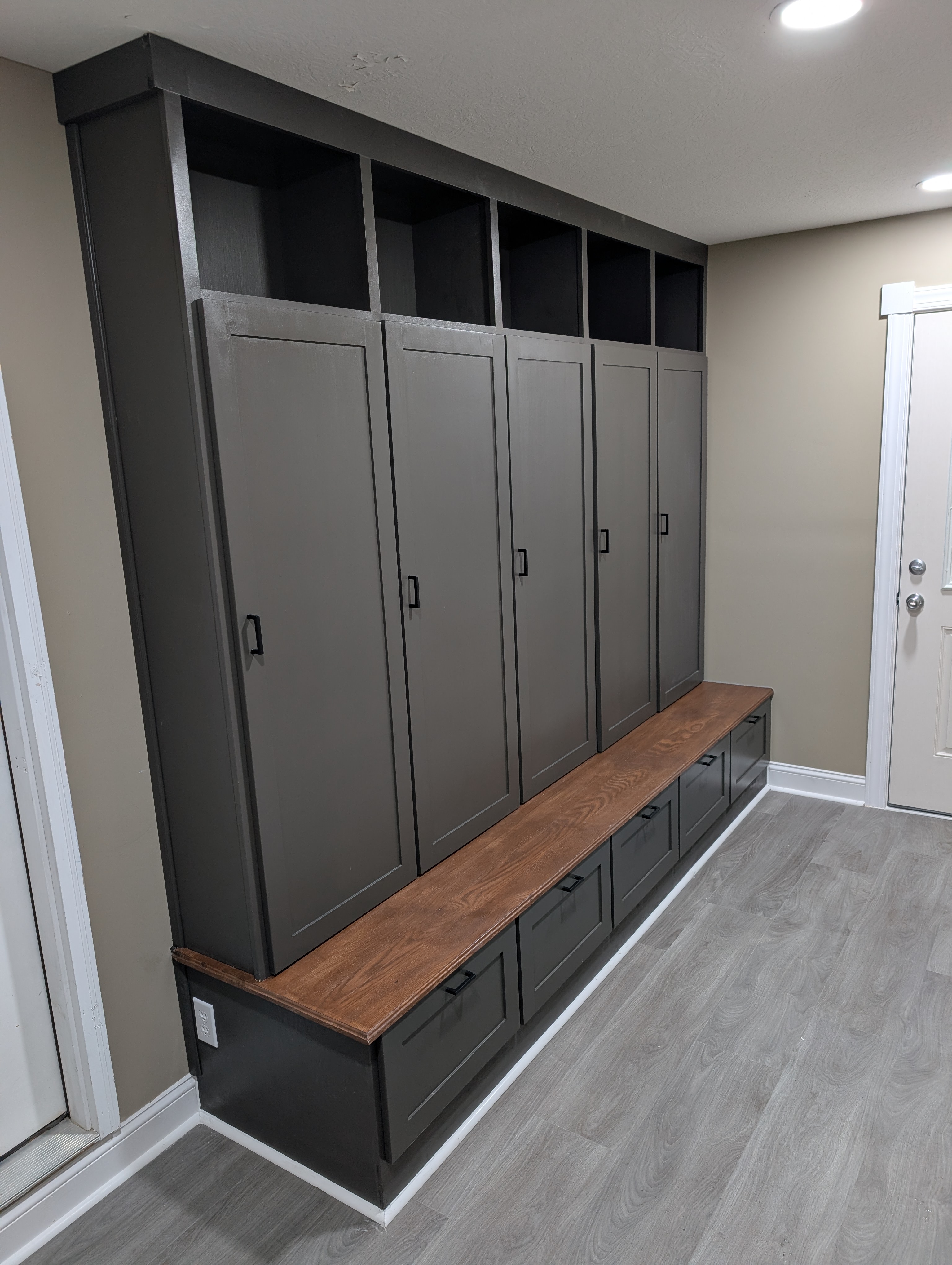 Custom charcoal gray mudroom lockers and bench seat
